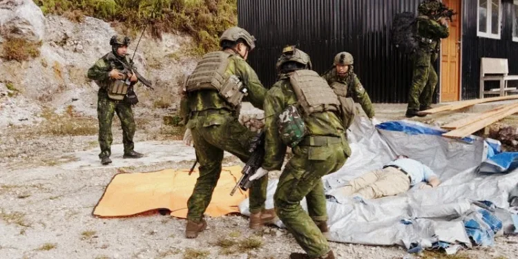 American Pilot Killed in Papua Attack as Indonesian Military Hands Body to Family